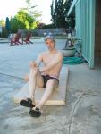 swimmer doing some stretches in Nike Bati Slide slippers