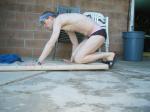 Swimmer in speedo getting ready to do push-ups