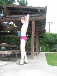 Thinking about laying down on the picnic table in his speedo
