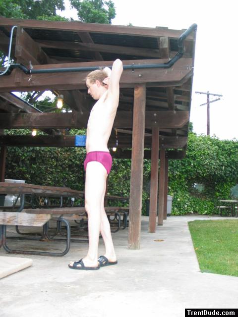 Thinking about laying down on the picnic table in his speedo