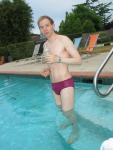 Drinking in a maroon Speedo