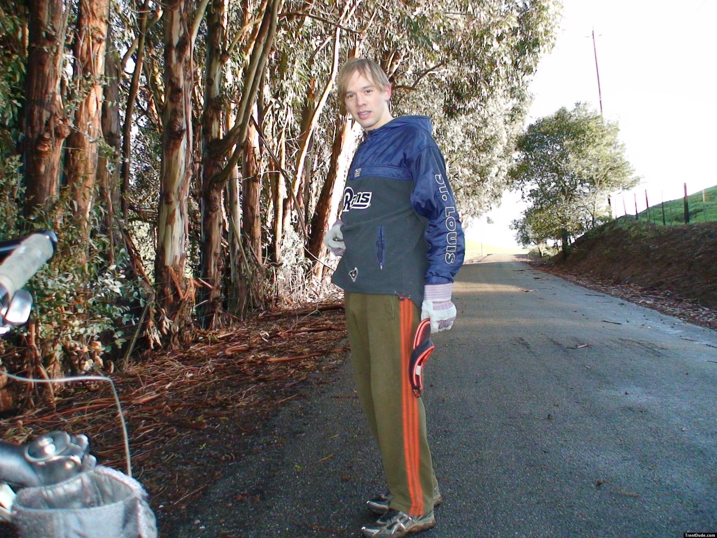 football windbreaker, addidas sweat pants in front of eucalyptus tree