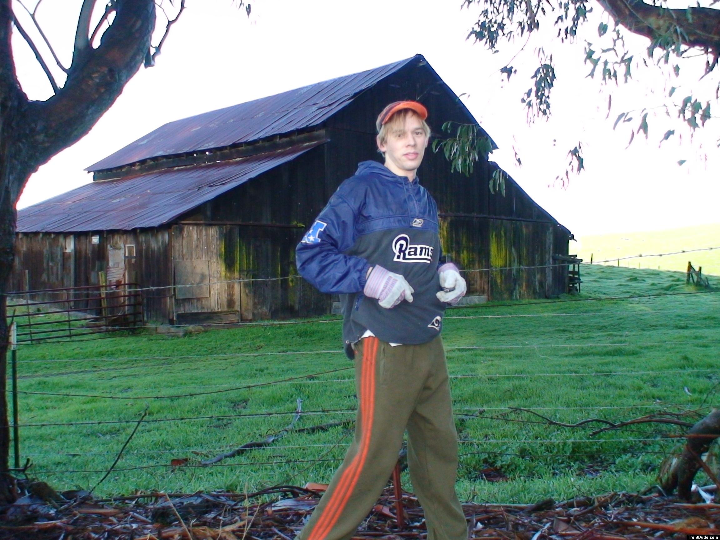 Stretching in football windbreaker, addidas sweat pants