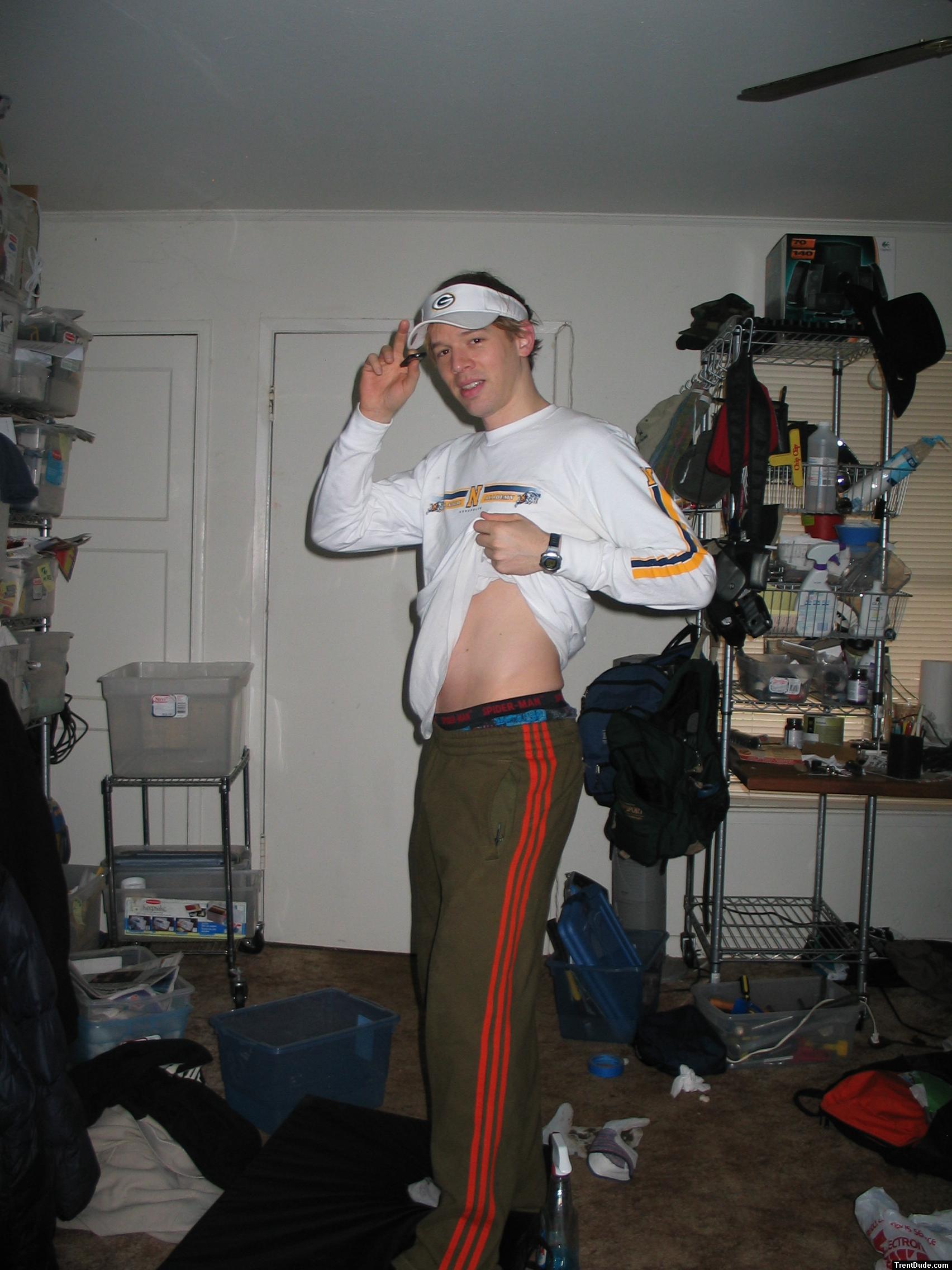 Spiderman boxers showing under Green sweat pants