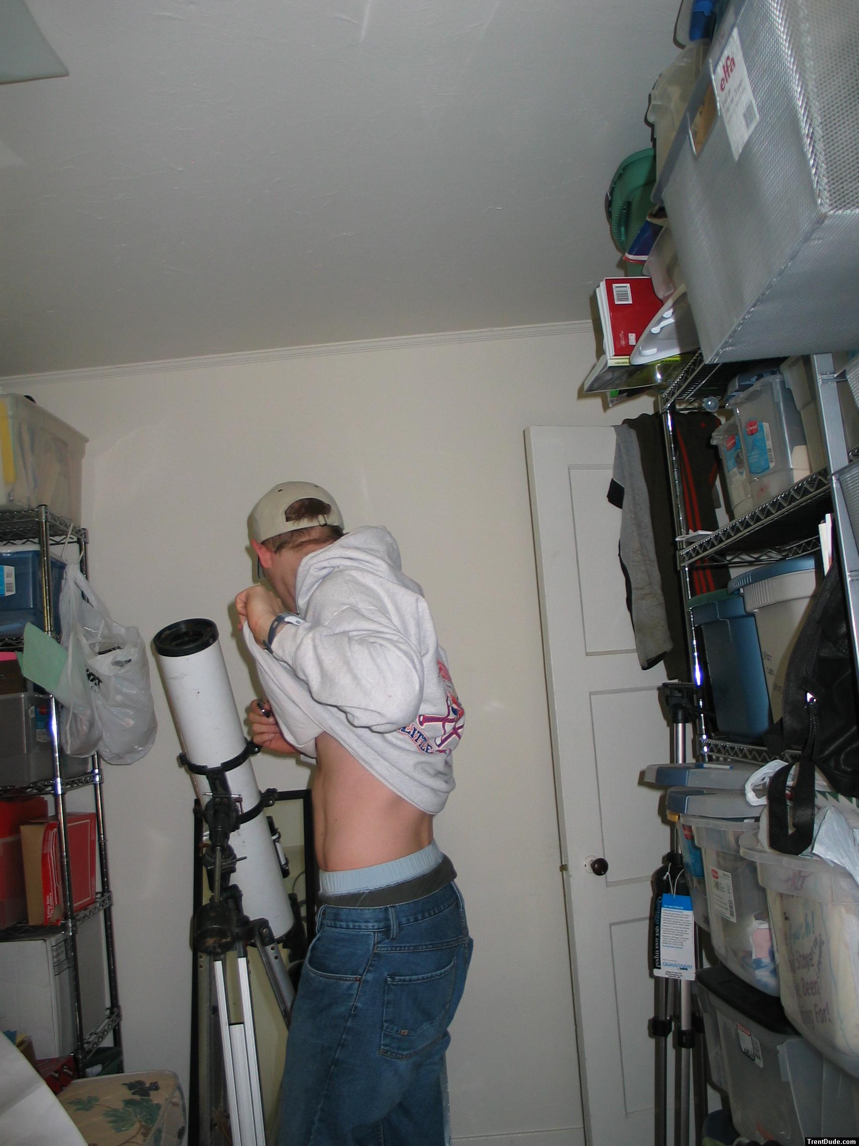 Guy checking out his abs, Quiksilver jeans,wal-mart boxers, sweatshirt