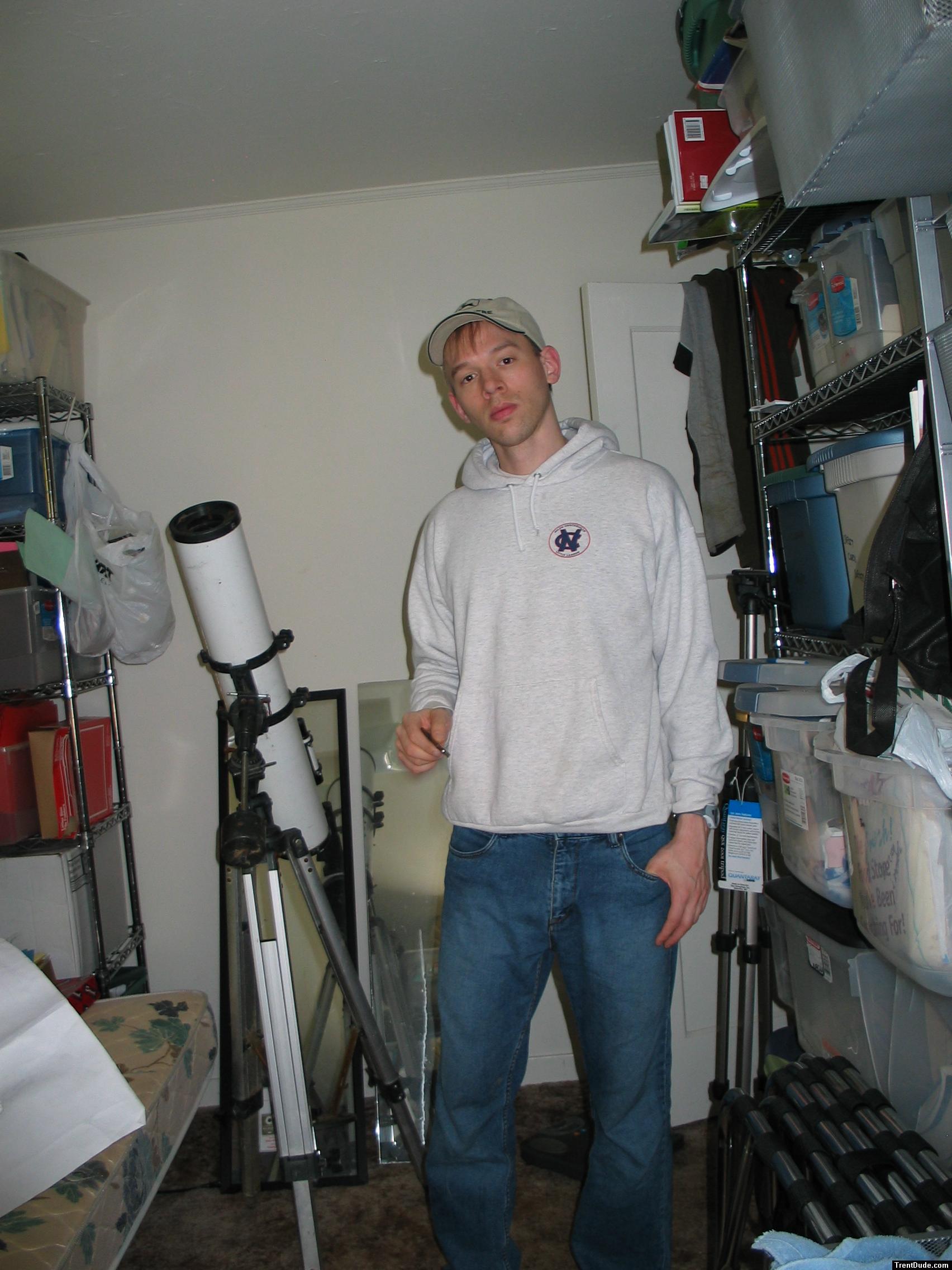 Student dude in Oneil jeans, sweatshirt (next to a telescope)
