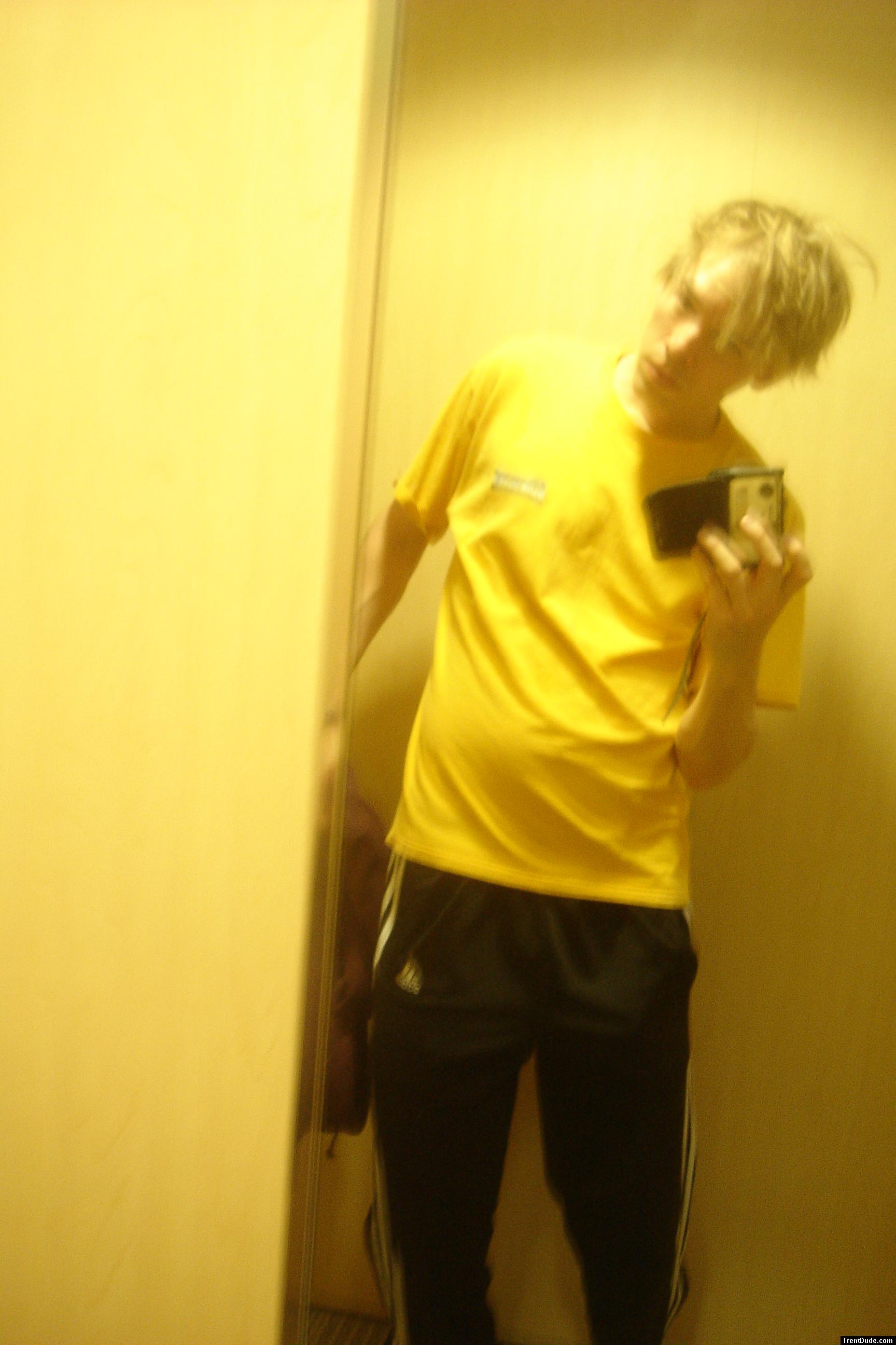 yellow t-shirt, punk hair (in a dressing room)