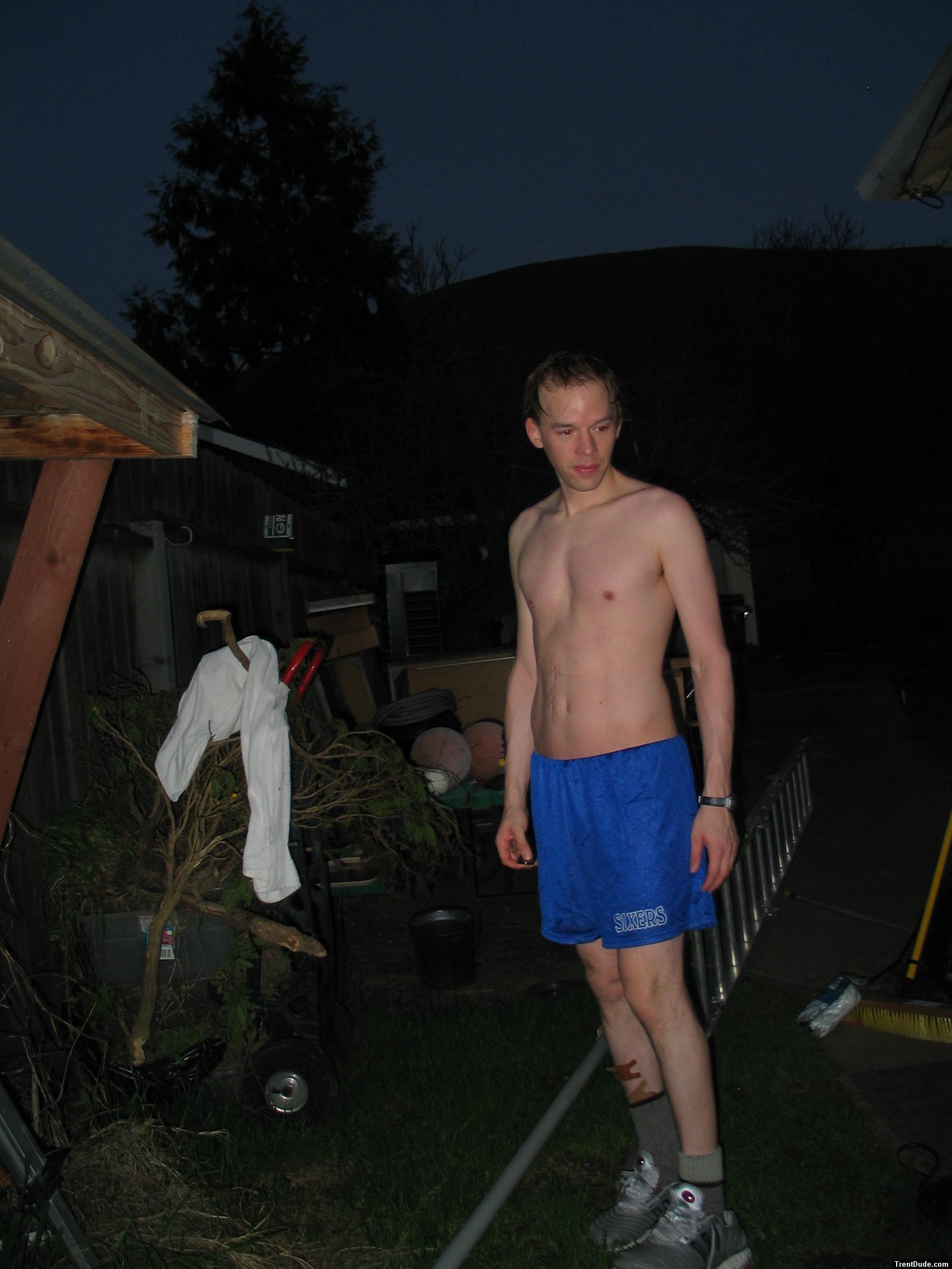 Outside in blue shorts and band-aids
