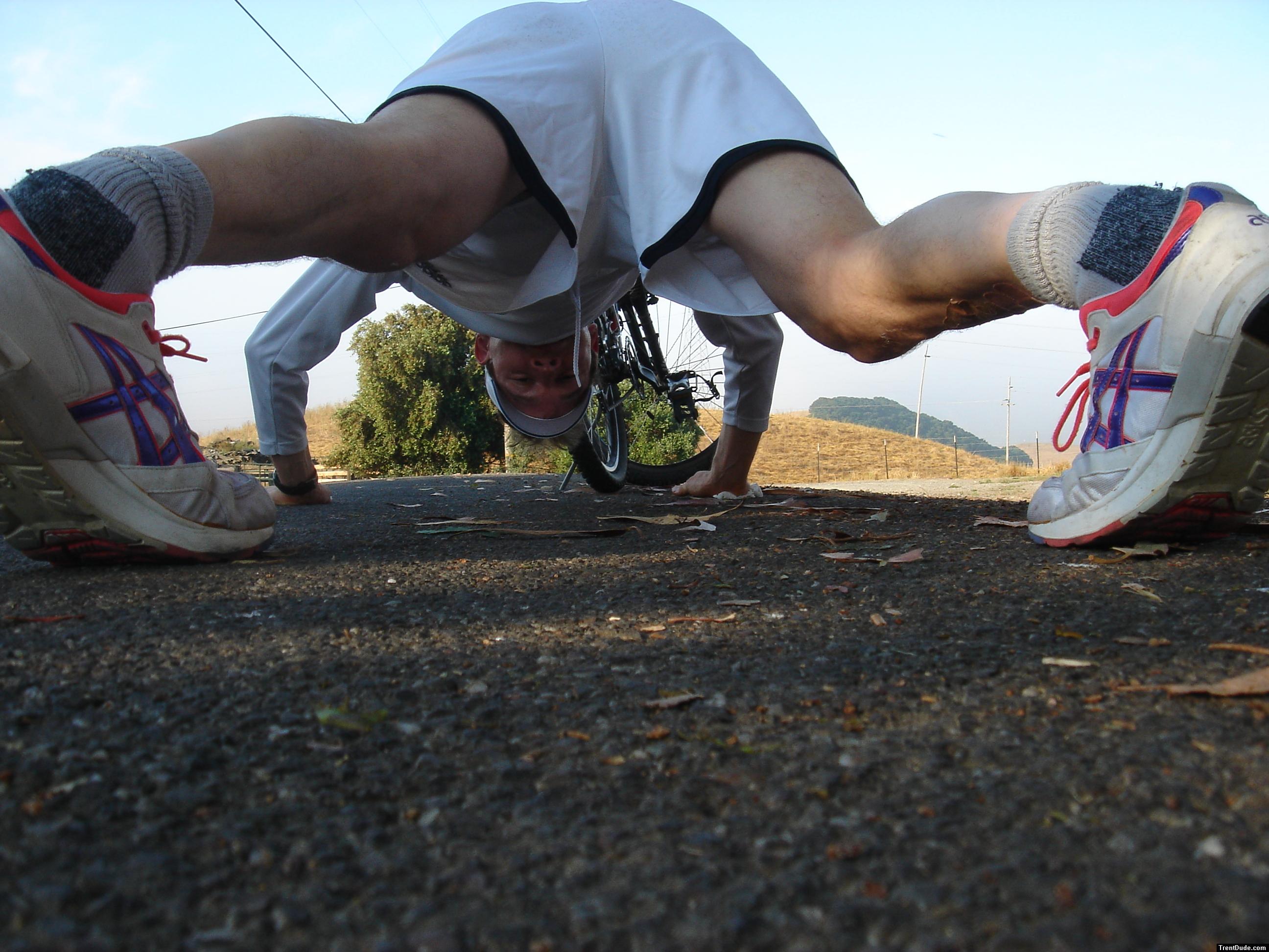 Trent doing pushups wearing Asics running shoes