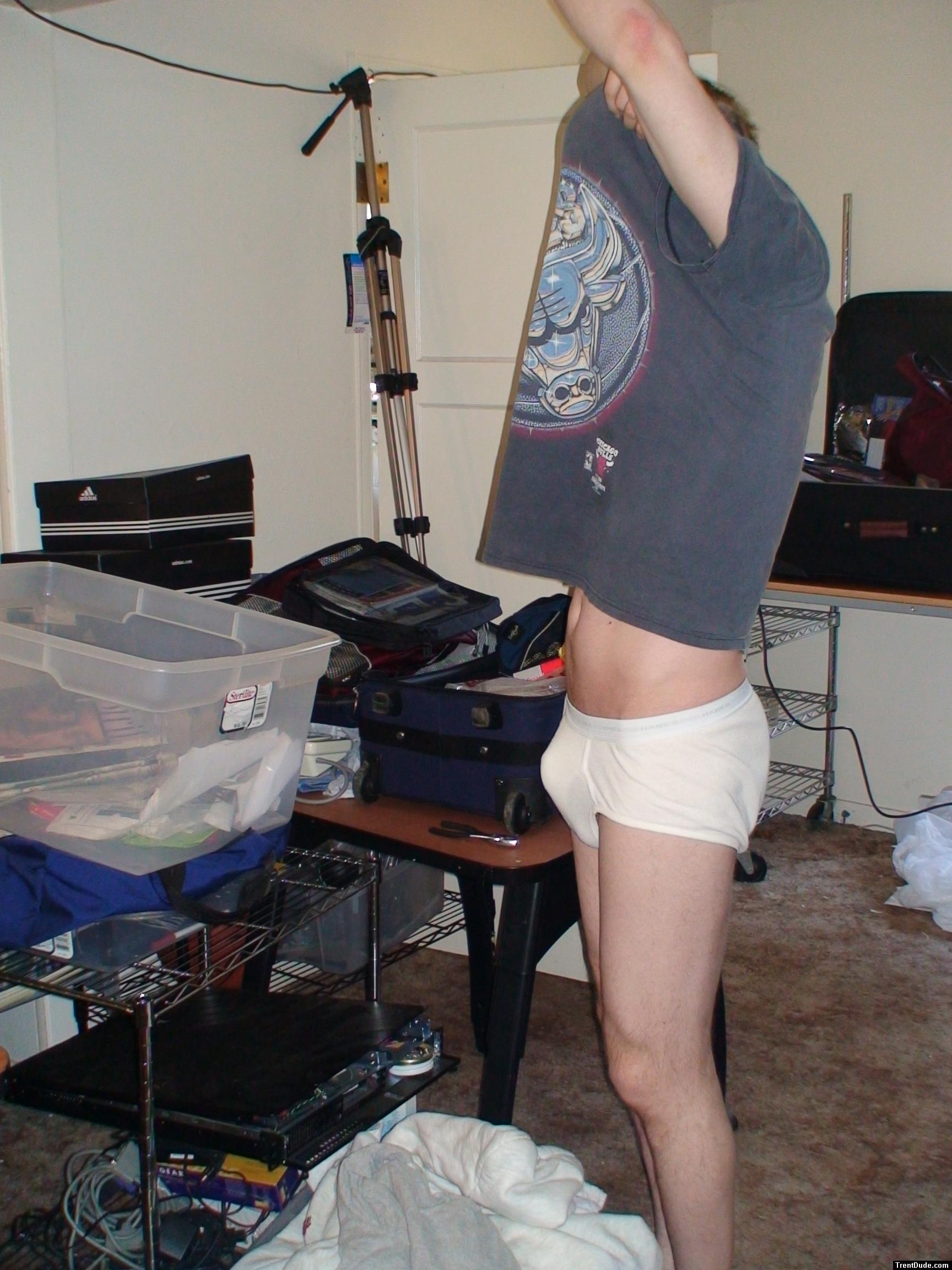 Preparding to launder his T-shirt