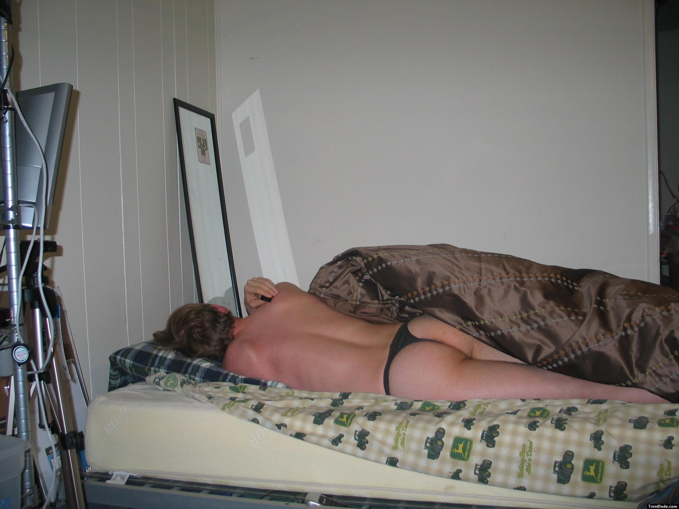 Grey thong in bed (showing too much of his butt)