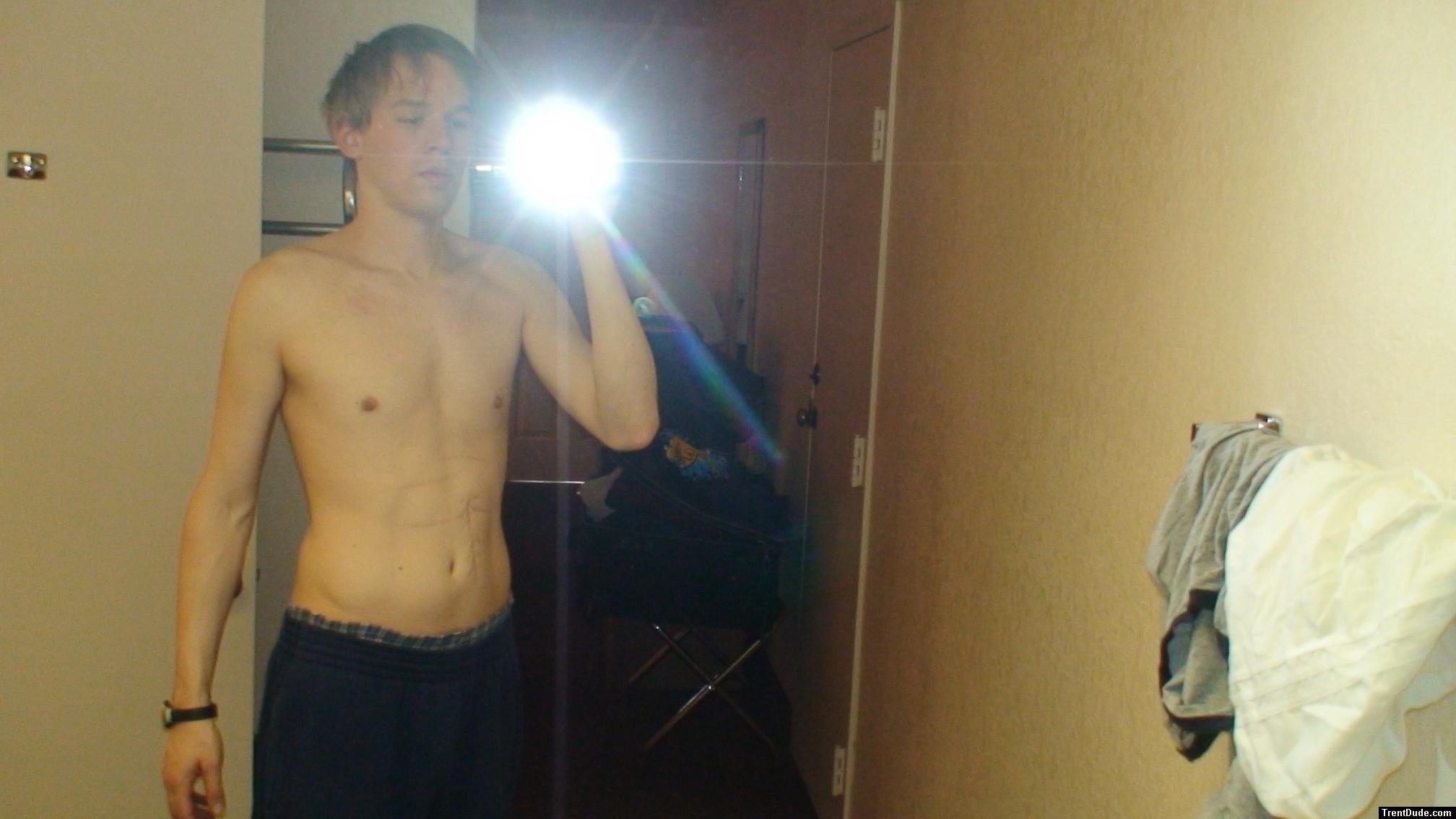Shirtless in a hotel room