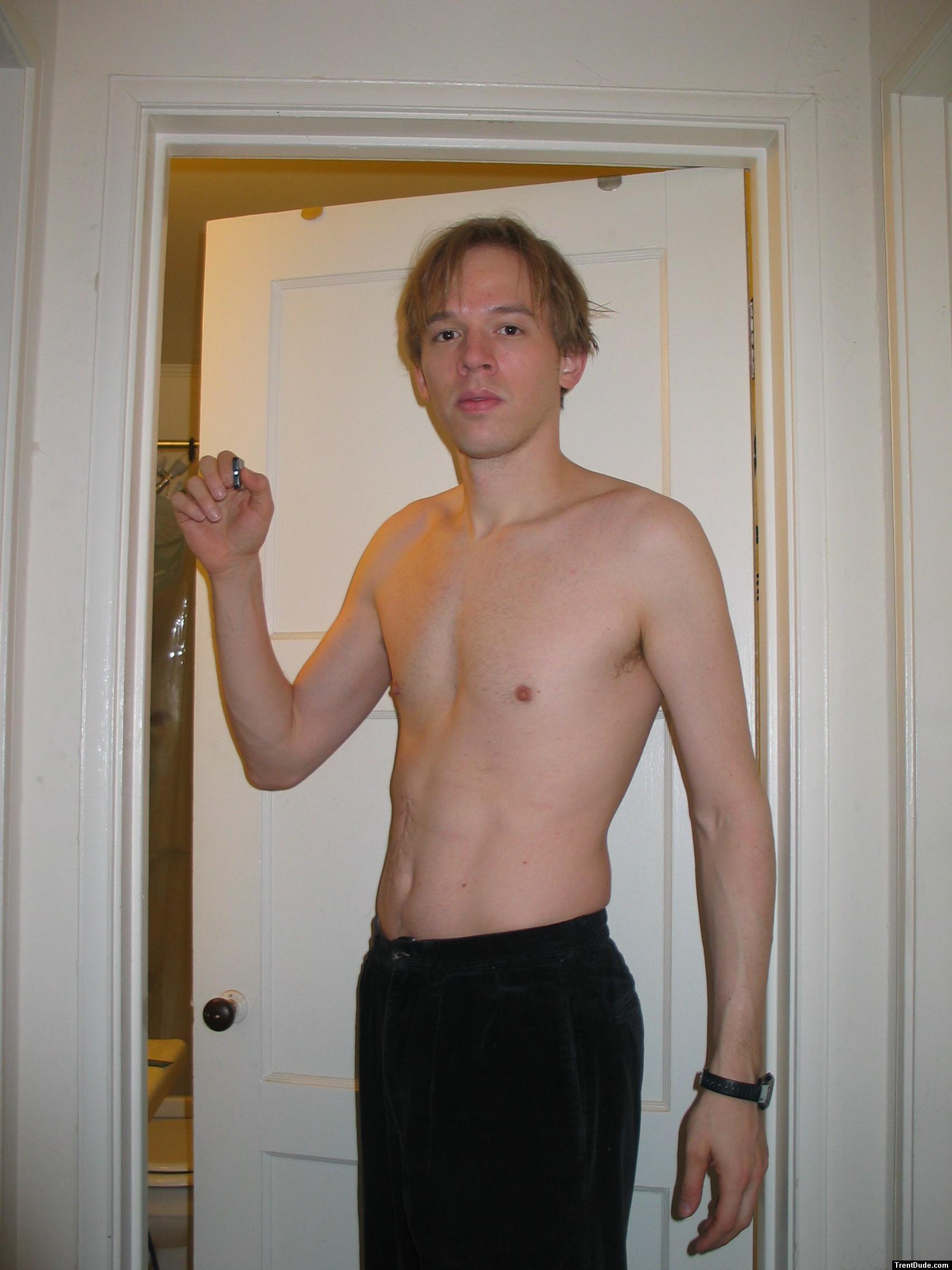 Shirtless in black pants, medium length hair