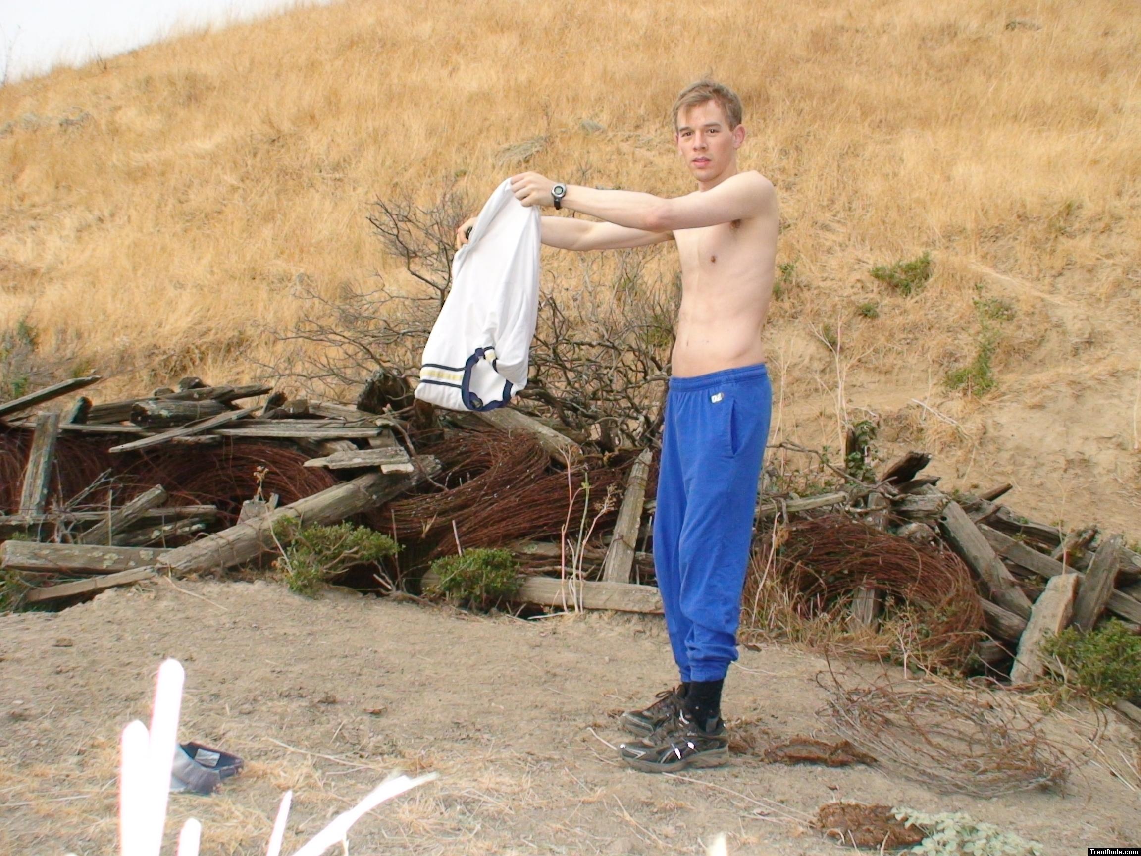 skinny dude pulls off shirt