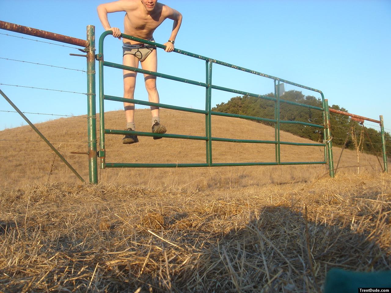 Climbing on a fence in Tommy Hilfiger underwear