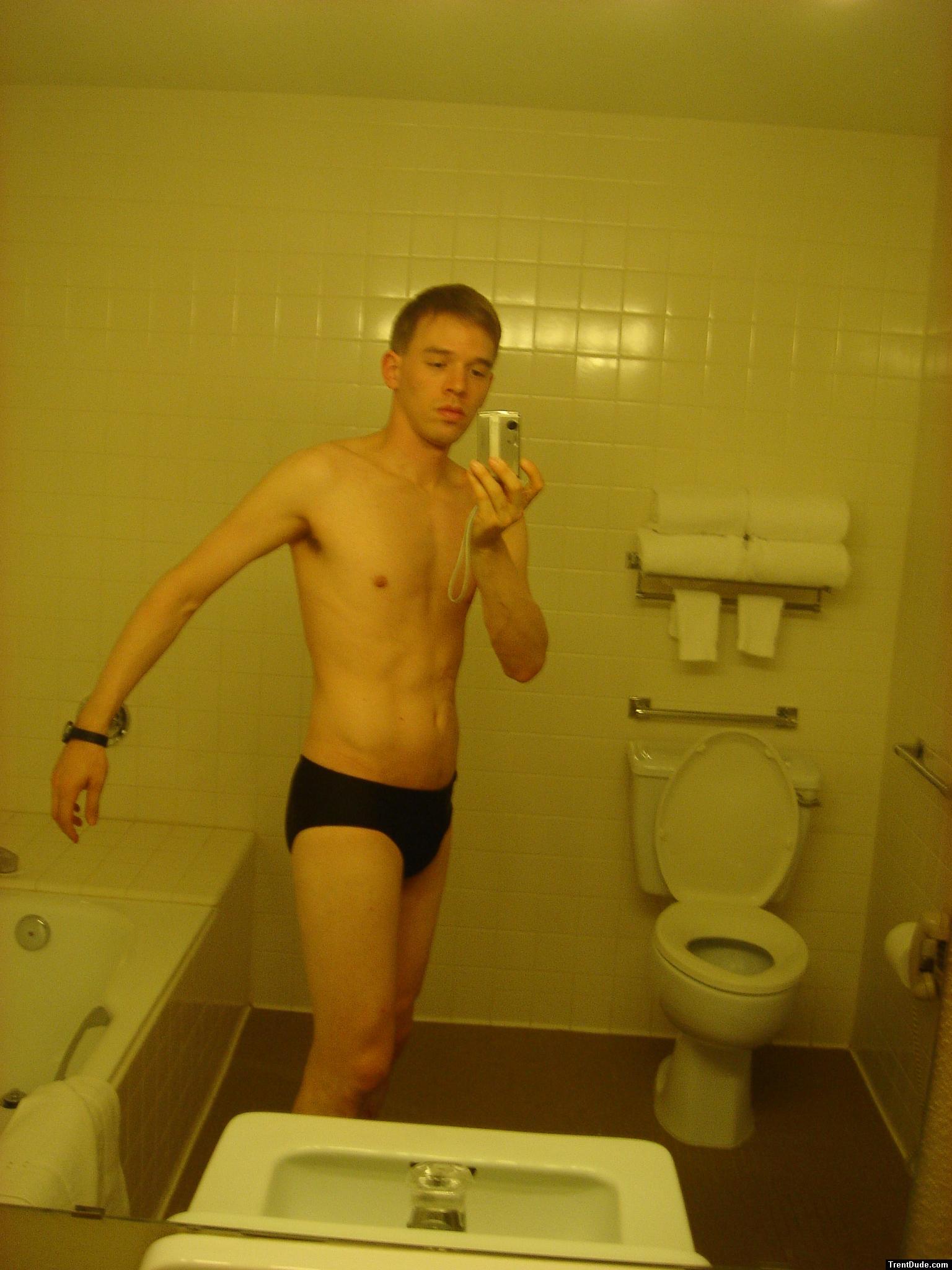 Black speedos, changing in a bathroom