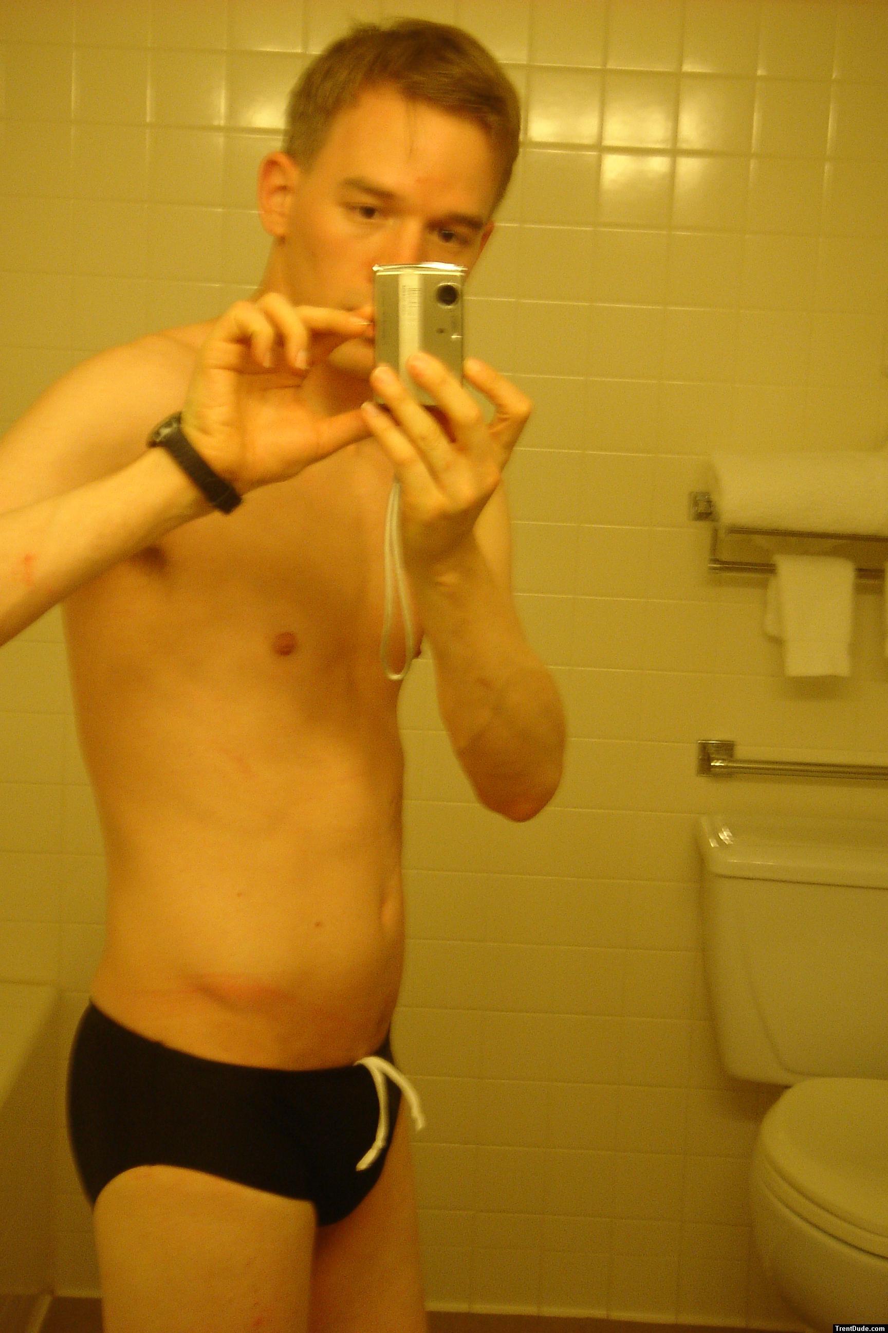 Black speedos, changing in a bathroom