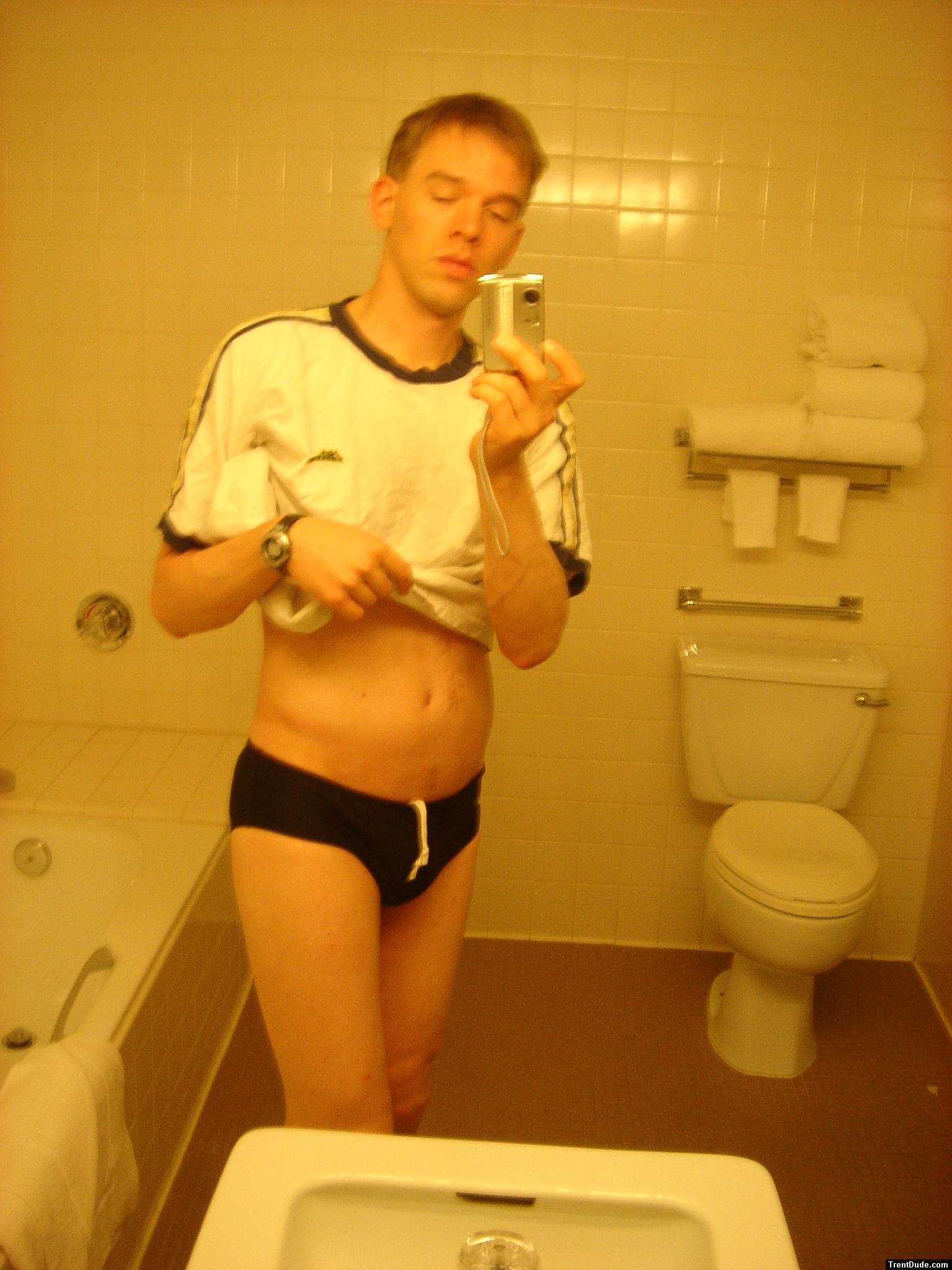 Black speedos, changing in a bathroom