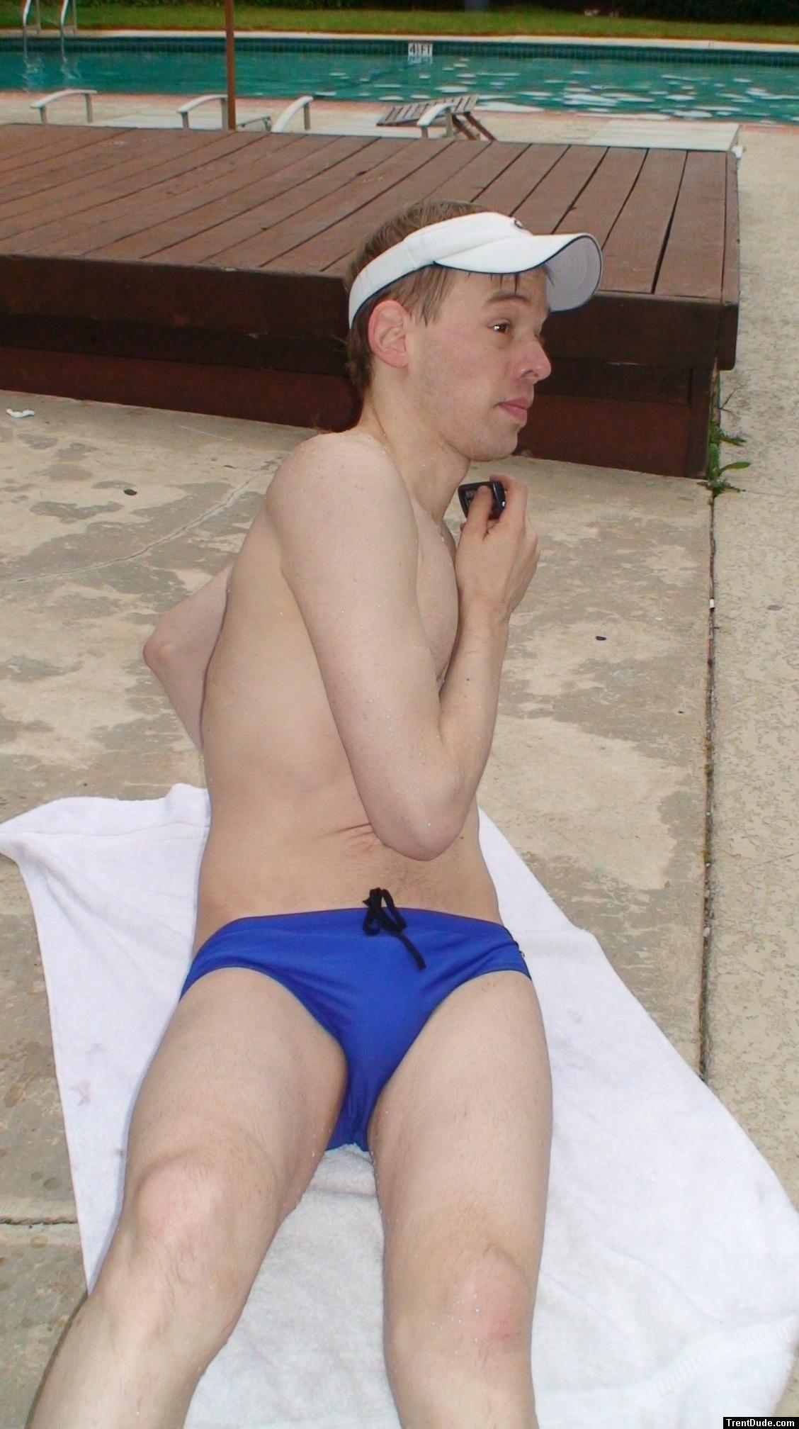 Stretching in blue nike swim briefs