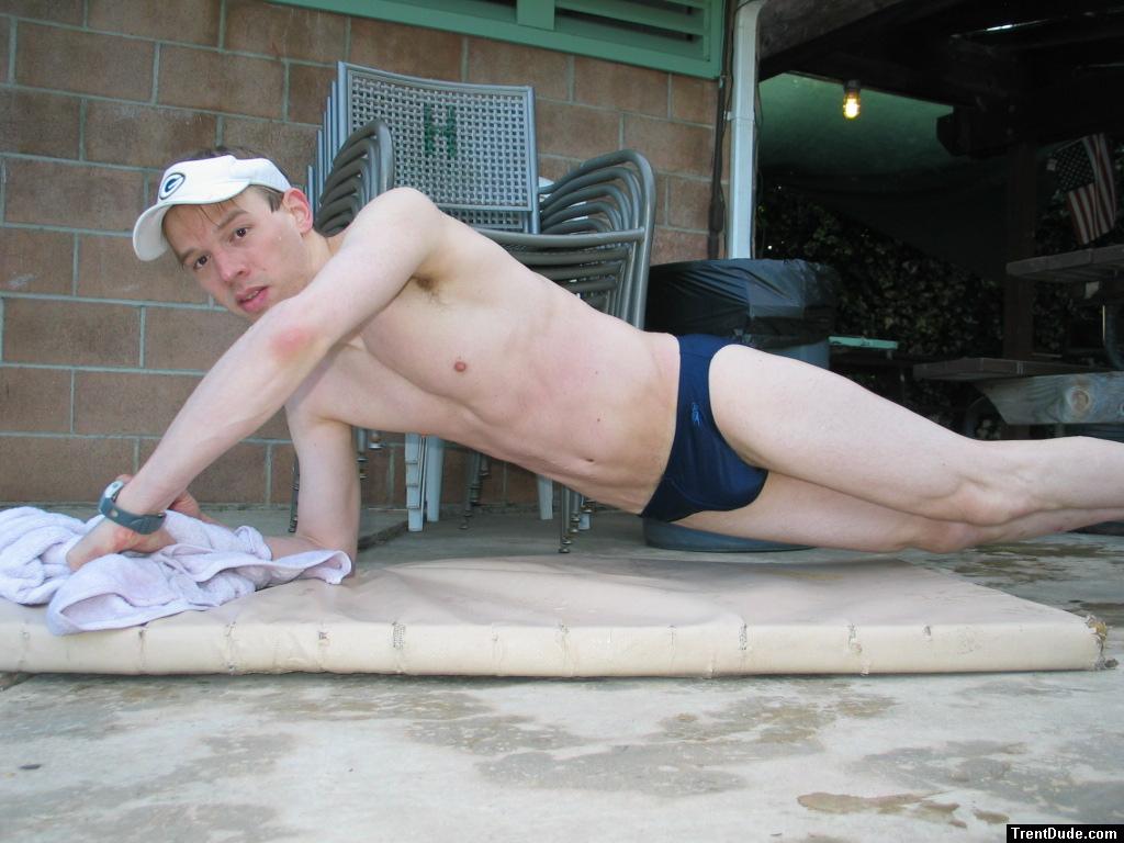 doing a pushup wearing a navy blue Speedo Solar 1" Swim Brief from Macys.com