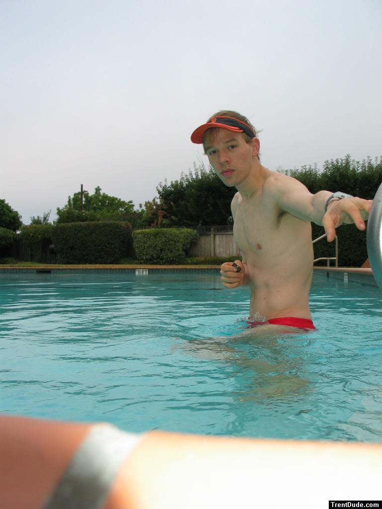 In the water wearing a Red Speedo