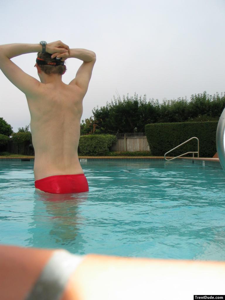 Swimmer stretching in a Red speedo
