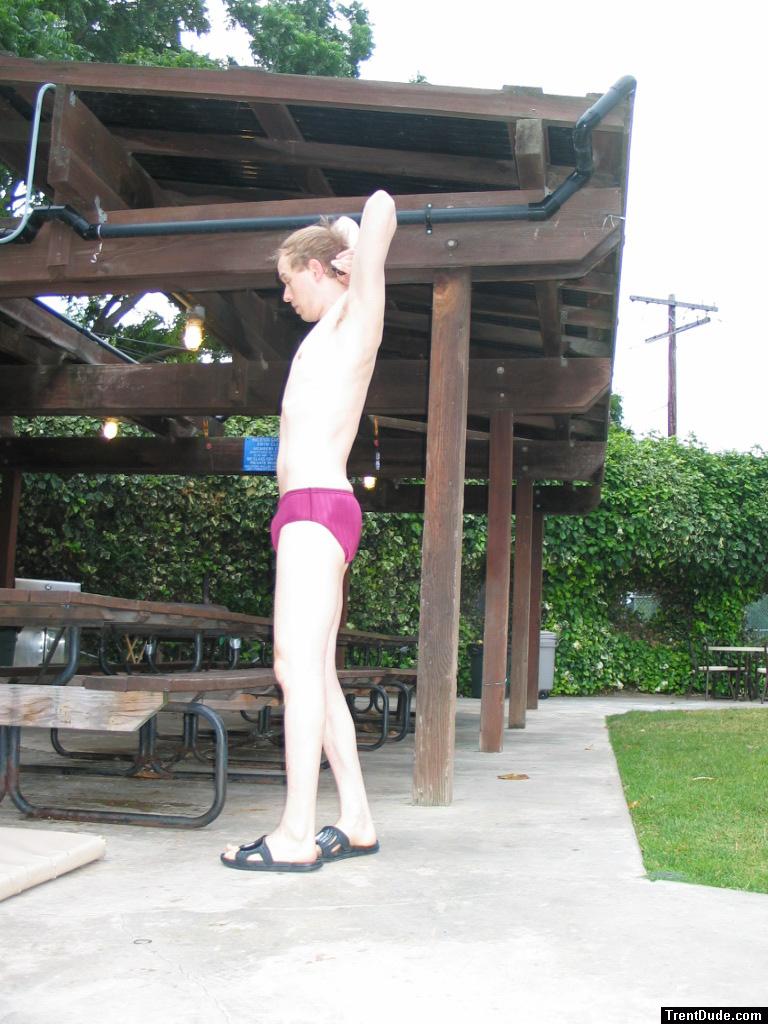 Thinking about laying down on the picnic table in his speedo