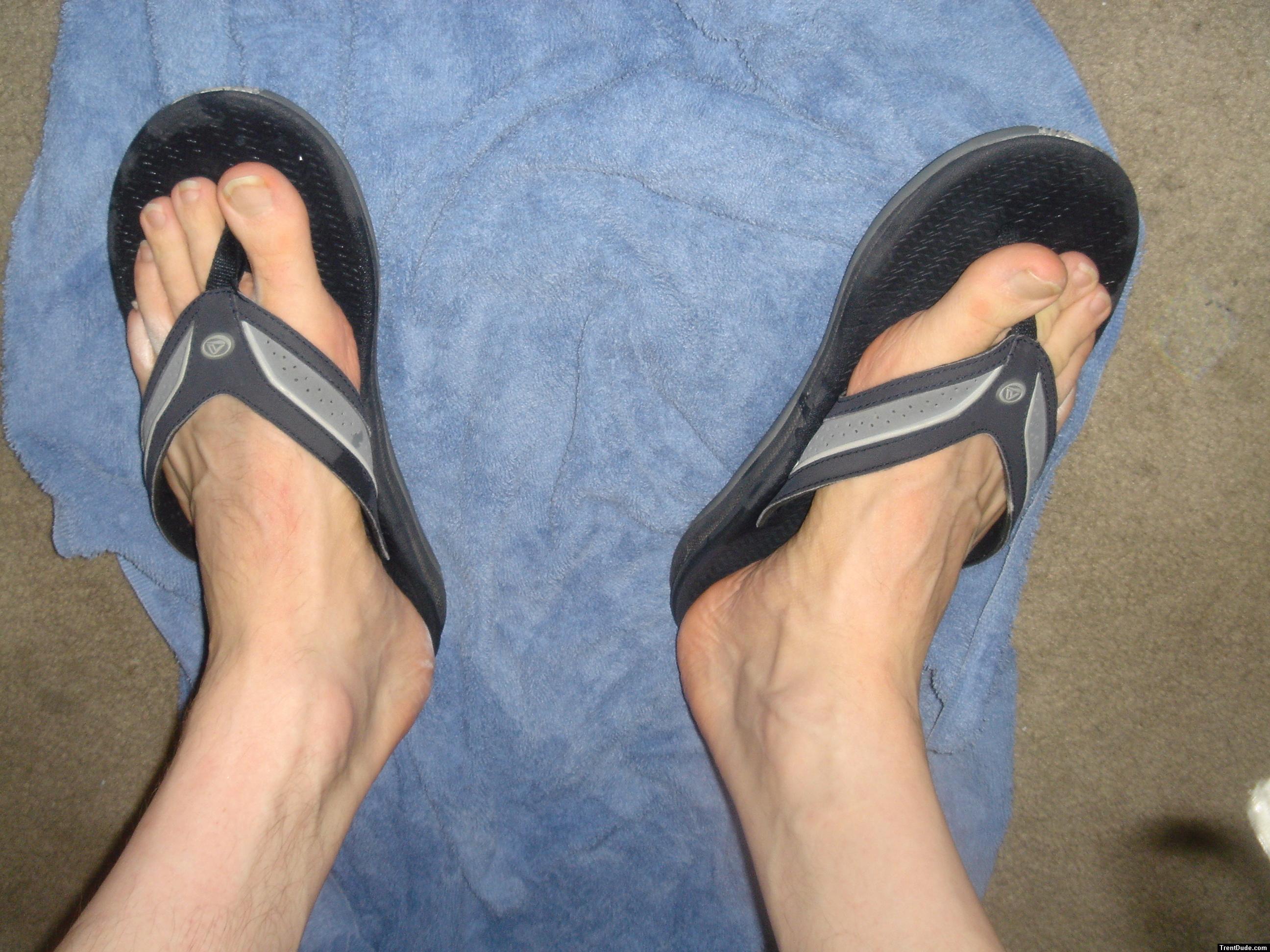 feet in Quiksilver slippers, showing veins