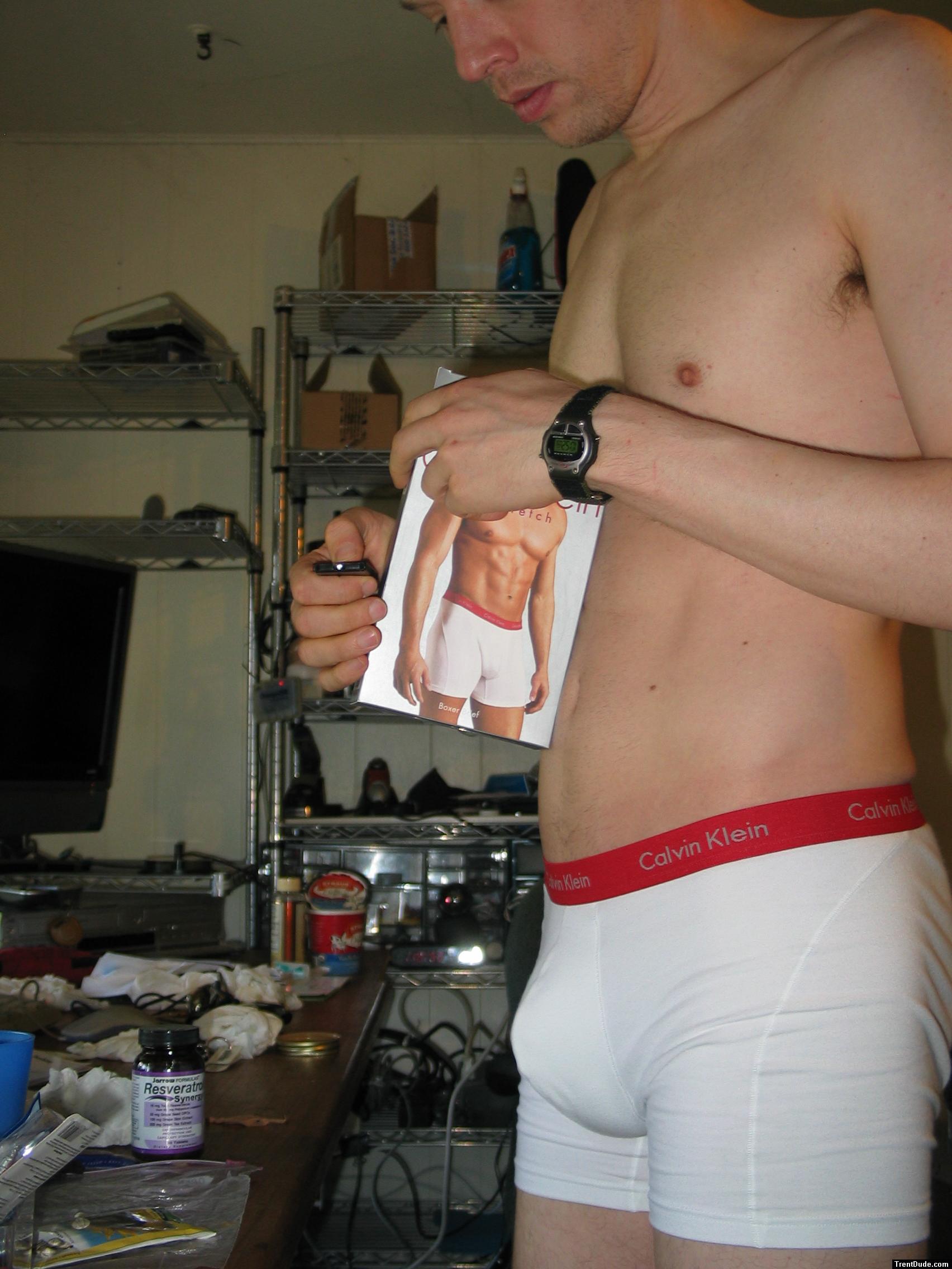 Opening his new pair of boxer briefs