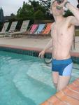 Taking a drink in a Calvin Klein swim boxer (rear)