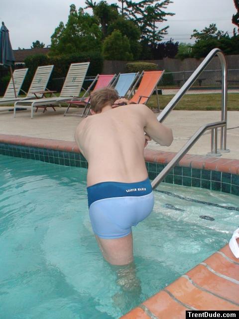 Stretching in a Calvin Klein swim boxer (rear)