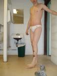 Swimmer in a white speedo (bandaids)