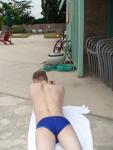 swimmer laying on a towel i(Speedo Fastskin Royal Blue brief from speedousa.com) (rear)