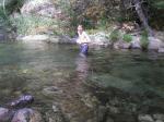Trent in a creek on a camping trip wearing boxers