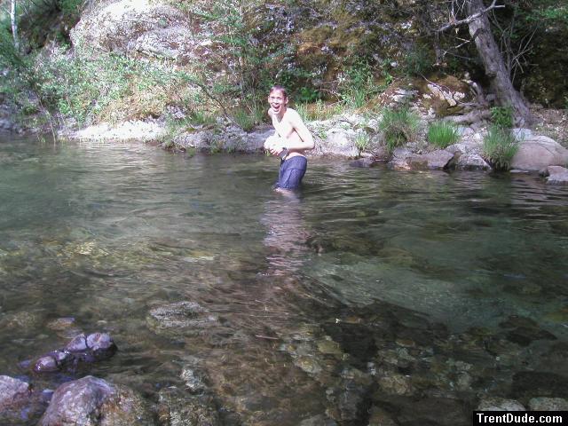 Trent in a creek on a camping trip wearing boxers