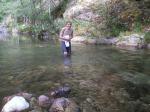 Trent in a creek on a camping trip wearing boxers