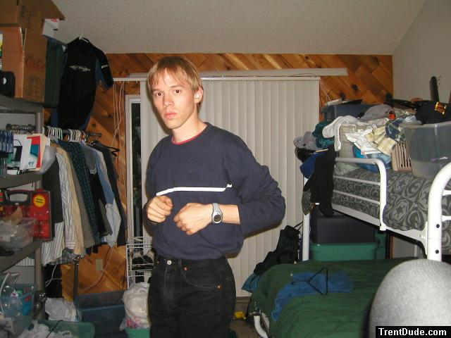 Trent in a blue shirt and black Levi's jeans