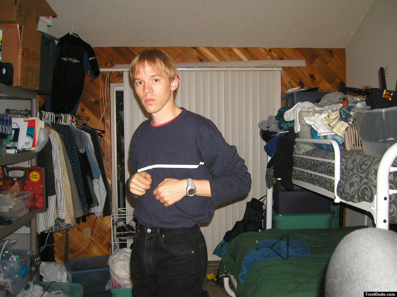 Trent in a blue shirt and black Levi's jeans
