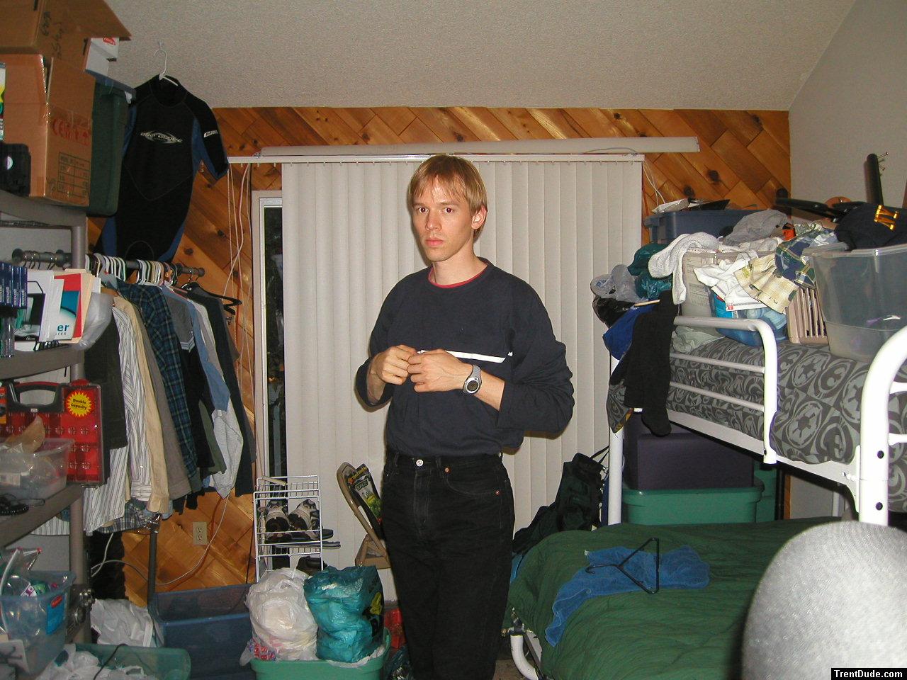 Trent in a blue shirt and black Levi's jeans