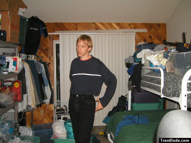 Trent in a blue shirt and black Levi's jeans