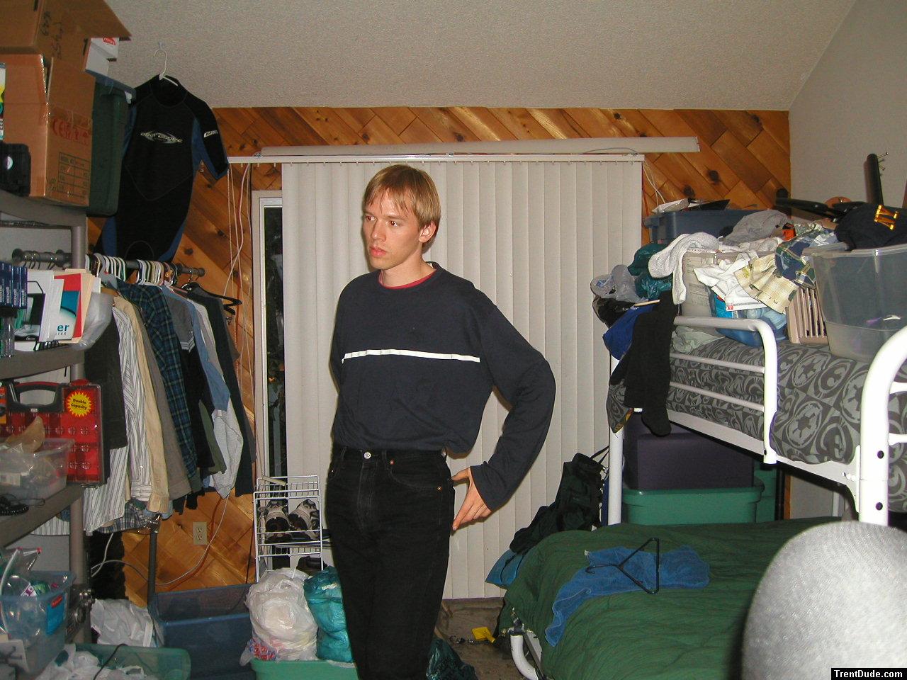 Trent in a blue shirt and black Levi's jeans