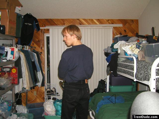 Trent in a blue shirt and black Levi's jeans