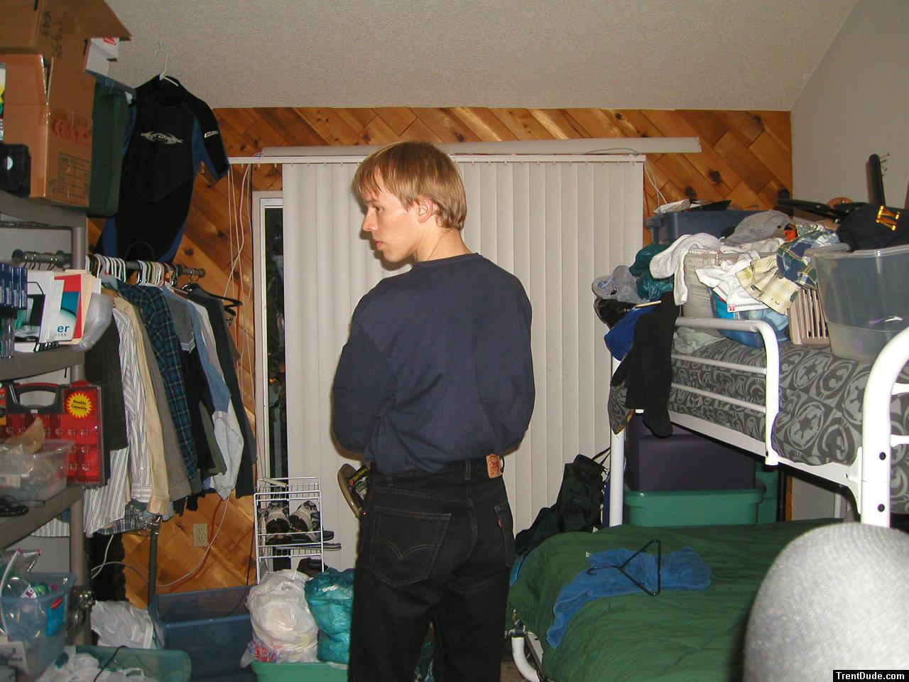 Trent in a blue shirt and black Levi's jeans