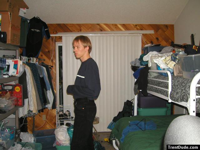 Trent in a blue shirt and black Levi's jeans