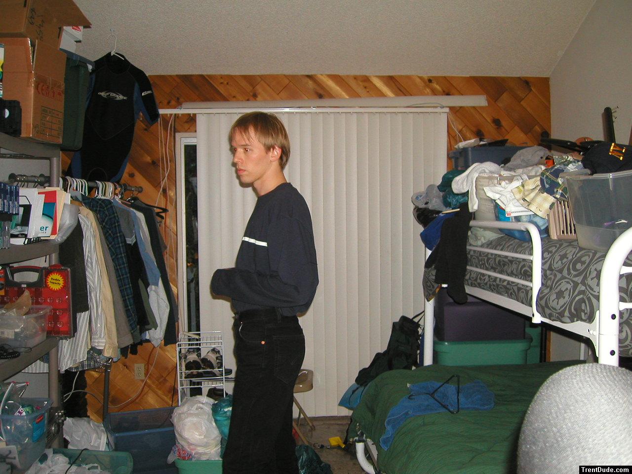 Trent in a blue shirt and black Levi's jeans