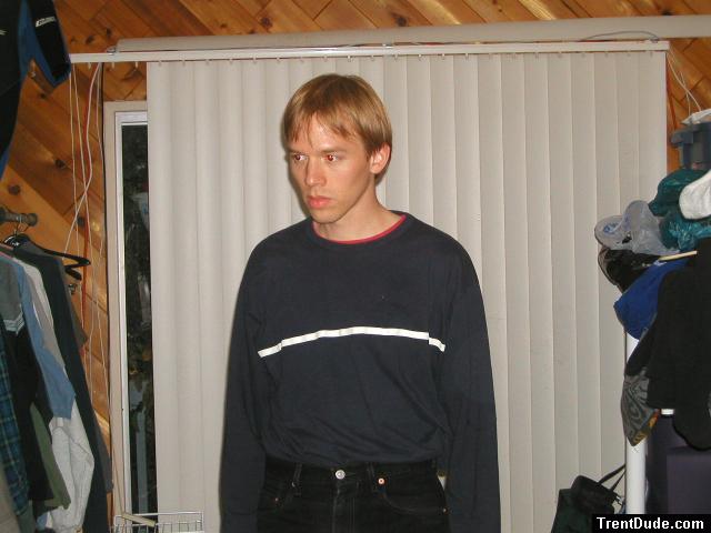 Trent in a blue shirt and black Levi's jeans