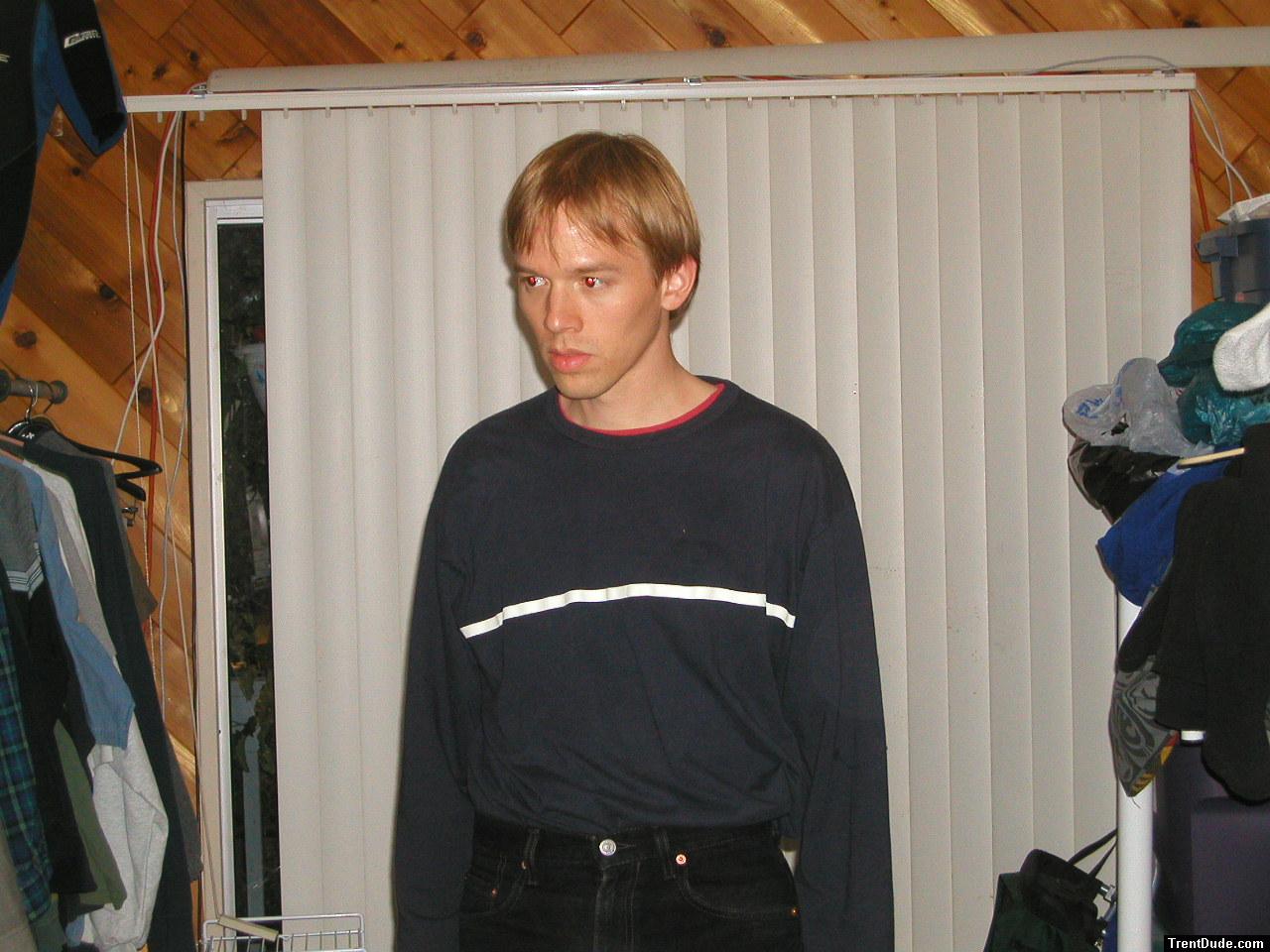 Trent in a blue shirt and black Levi's jeans