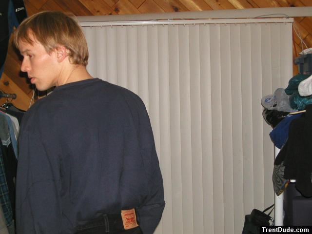 Trent in a blue shirt and black Levi's jeans