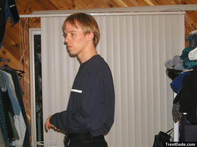 Trent in a blue shirt and black Levi's jeans