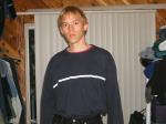 Trent in a blue shirt and black Levi's jeans